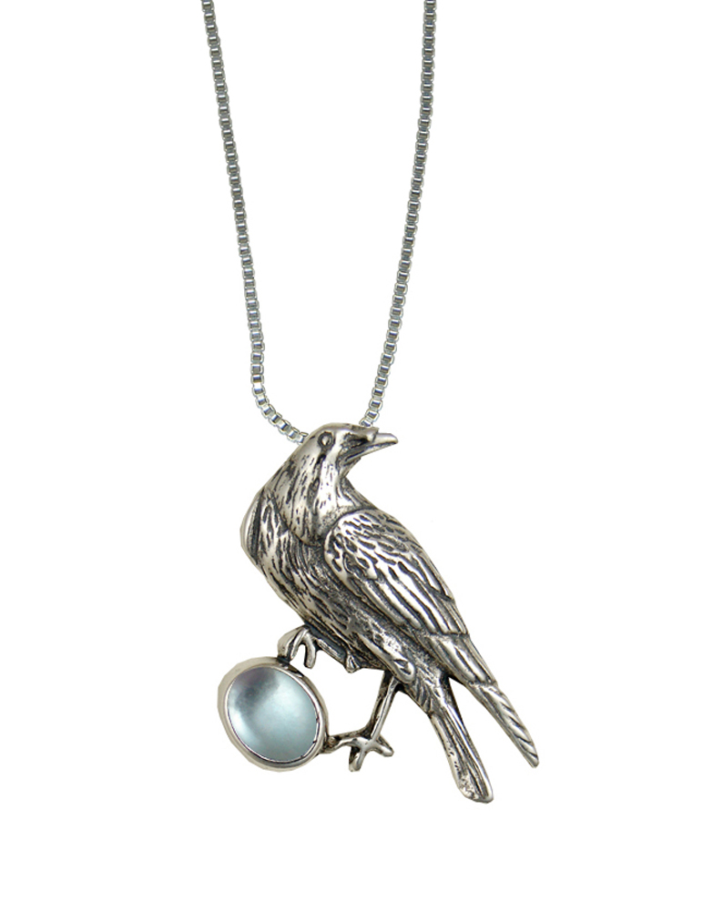 Sterling Silver Raven Pendant With Blue Topaz